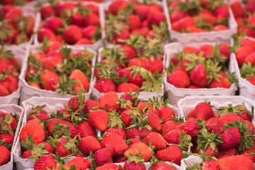 Natural strawberries in boxes at a farmers market