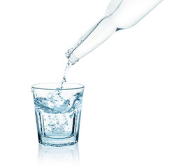 bottle pouring water into a glass