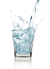 water splash in a glass isolated on white