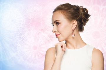 smiling woman in white dress with pearl jewelry