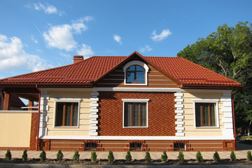 Red brick house with red roof