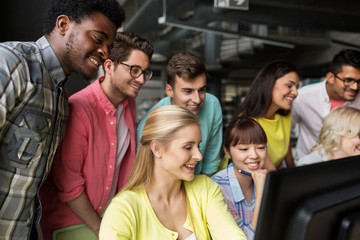international students with computers at library