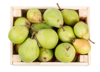Wooden box full of fresh pears isolated on a white