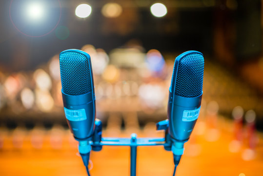 Microphone on stage against a background of auditorium - shallow depth of field