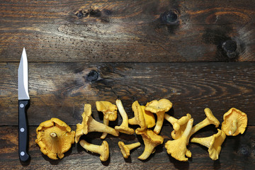 chanterelles on wooden boards for background use