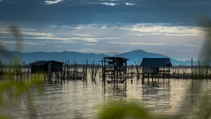 Fototapeta na wymiar Traditional fishermen wooden houses in Songkhla Lake, Thailand