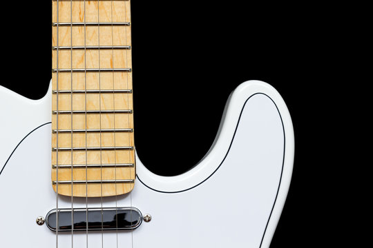 white electric guitar, isolated on black