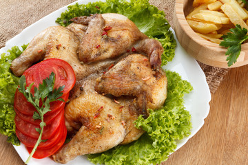 Chicken fried with potato and vegetables
