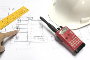 architect hand pointing the finger at blueprints