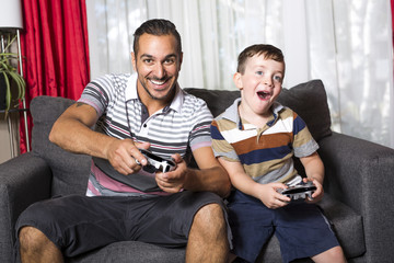 Father and son playing video game