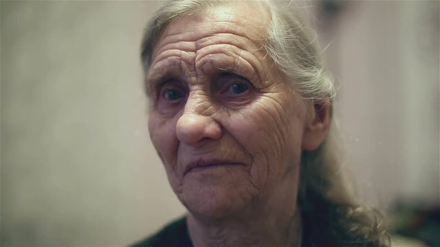 Old woman with long gray hair.