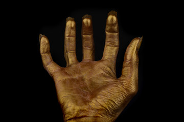terrible human hand on a black background