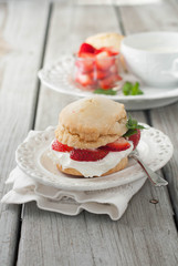 Classic strawberry shortcake with whipped cream. Wooden rustic background. 
