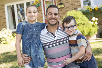 Portrait of happy family in front  house