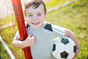 Young caucassian soccer player football