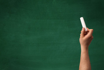 Hand writing on clean blackboard