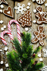 wood background with Christmas tree, candy, cookies, marshmallow