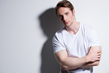 Portrait of young man in white t-shirt.