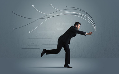 Running businessman with device and hand drawn lines