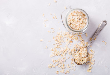 Healthy breakfast Organic oat flakes in a glass jar .Clean Eating or Vegetarian concept.Copy space.selective focus.