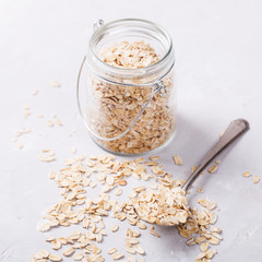 Healthy breakfast Organic oat flakes in a glass jar .Clean Eating or Vegetarian concept.selective focus.
