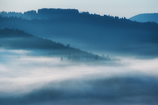 Fototapeta beautiful landscape with mountain veiw and morning fog on sunrise