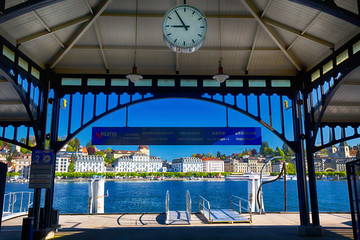 Ship harbor in the center of Lucerne city with the old town and Lucerne lake (Vierwaldstatersee) in the background.