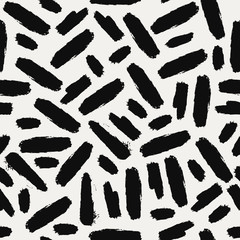 Seamless pattern with hand drawn brushes in black on cream background.