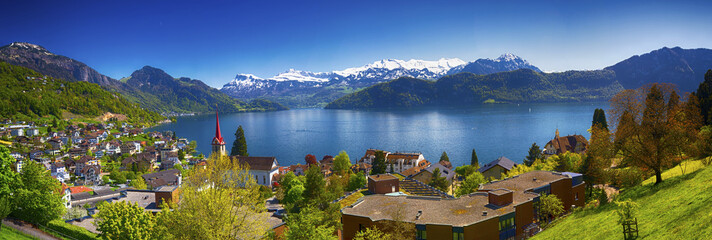 Panorama image of village Weggis, lake Lucerne (Vierwaldstatersee), Pilatus mountain and Swiss Alps...
