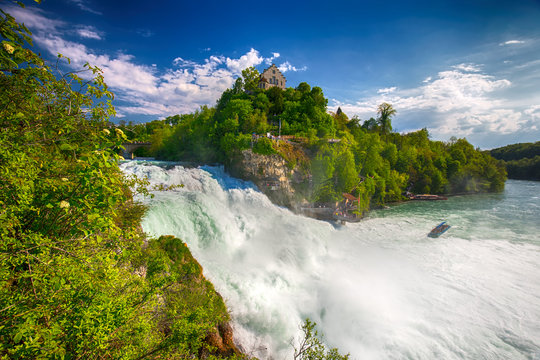 Fototapeta View to Rhine falls (Rheinfalls), the largest plain waterfall in Europe. It is located near Schaffhausen, between the cantons of Schaffhausen and Zurich