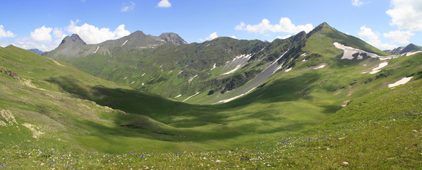 Summer landscape in mountains and the blue sky with clouds. panorama