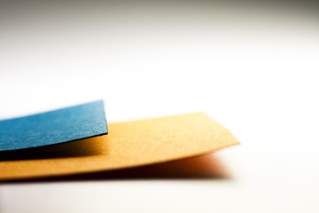 Colorful paper shapes with paper background