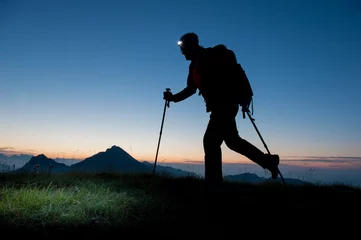 Gardinen hiking in the mountains at dawn © pierluigipalazzi