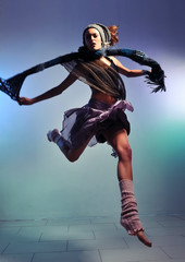 Fototapeta na wymiar woman jump with colorful bacground - concept