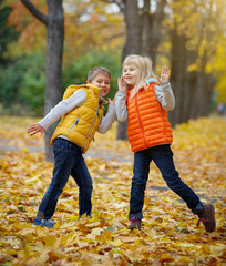 Happy Kids in Autumn Park