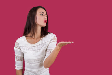 Girl in sweater air kissing