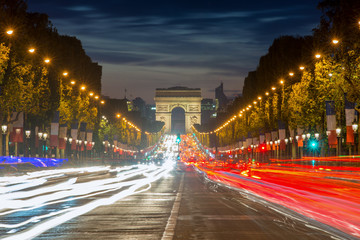 Fototapeta na wymiar Arc de triomphe Paris city at sunset, France. Champs Elysees