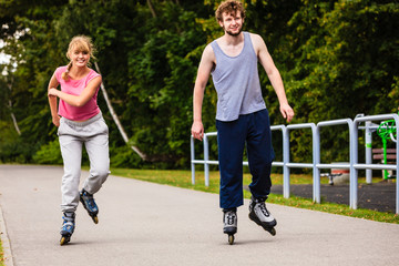 Fototapeta premium Young people casually rollblading together.