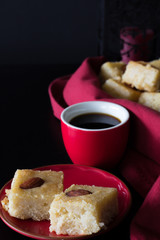 Basbousa and Coffee with Dark Background Vertical with Copy Space