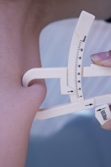 Woman measuring body contouring
