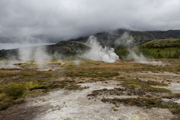 Fototapeta na wymiar Steaming geysirs in Iceland