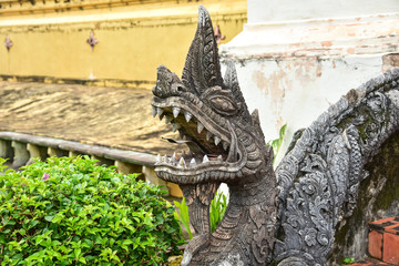 Stone-Carved Naga Statue on the Handrail at Wat Phra That Luang in Vientiane, Laos