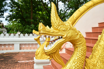 Golden Naga Sculpture on the Handrail of Haw Phra Kaew in Vientiane, Laos