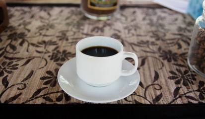 White coffee cup and black coffee

