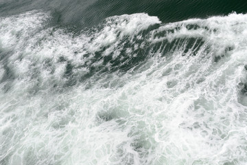 Fototapeta na wymiar Deep blue sea with foam on the surface