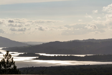 Arenal lake reflecting the sun