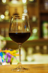  wineglass on a bar in a traditional style pub