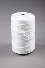 Harvest fishing tackle of PE plastic line on grey background