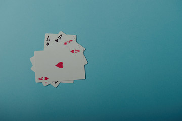 A winning poker hand of four aces playing cards