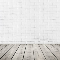 Gray wooden floor and white brick wall